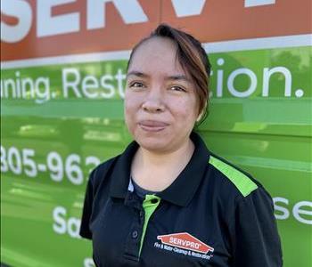 Jozy Rosas standing in front of SERVPRO EV