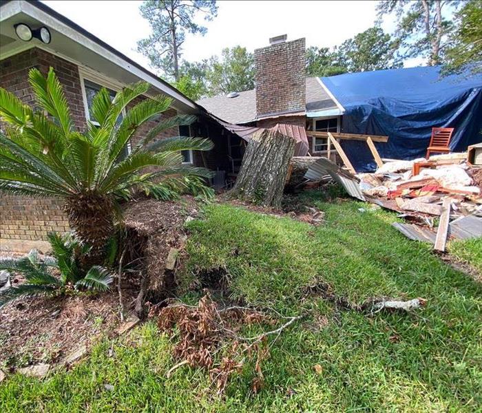 Exterior damage to Santa Ynez home after a tree fell.