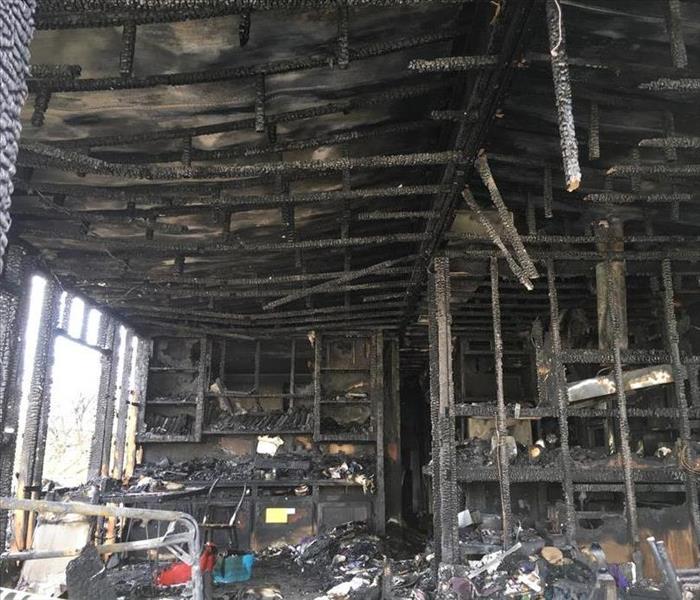 Inside of a building with everything turned to black and burned down 