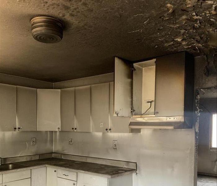 Badly burned kitchen and roof from a home fire